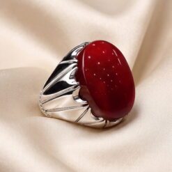 Deep red Yemeni agate cabochon set in a handmade sterling silver ring with a scalloped claw bezel