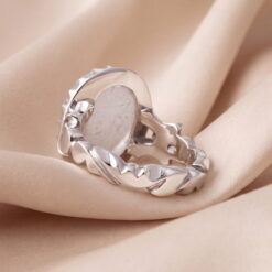 The Dur al-Najaf silver ring seen from behind, showing the open setting and the carved silver band