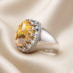 Side profile of the natural citrine silver ring showing the open back of the setting and the tapered band